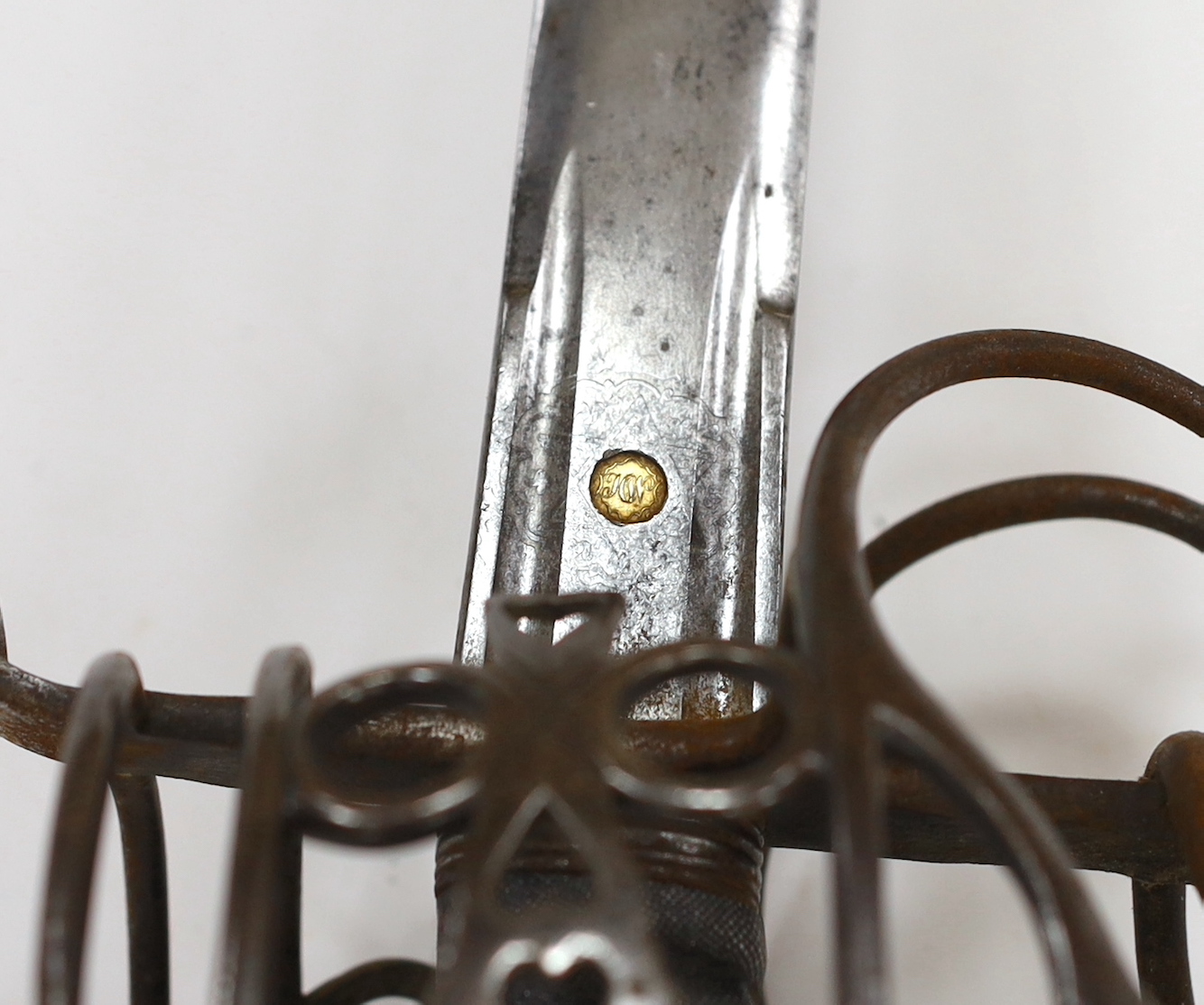 An early 19th century regulation Scottish infantry officer's Wilkinson’s broadsword of the 74th Regiment, with steel basket and pommel, double fullered blade engraved with VR cypher and the motto ‘Nemo me impune lacessit